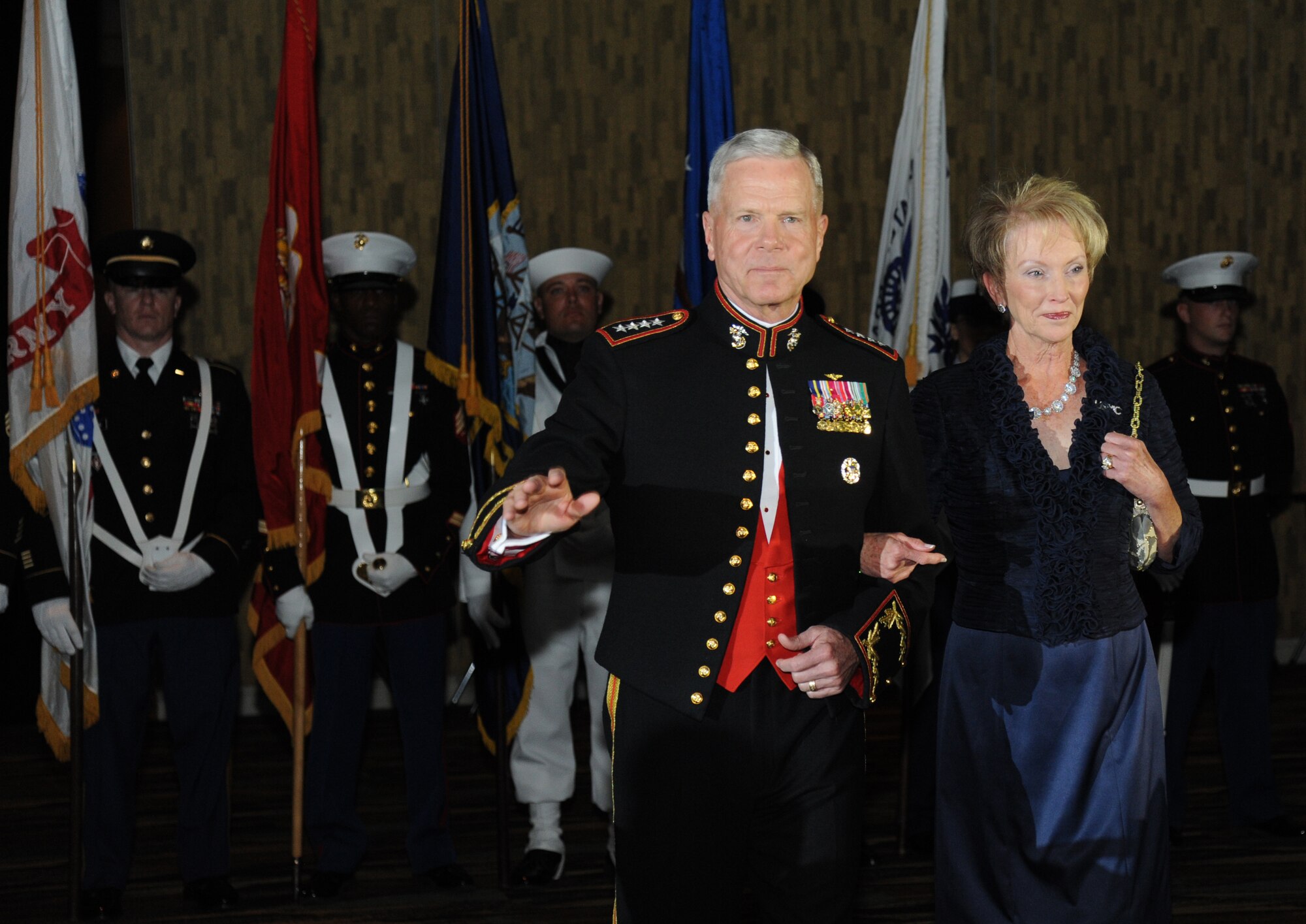 Gen. James Amos, Commandant of the Marine Corps, and his wife are introduced during the 35th Annual Salute to the Military Oct. 22, 2013, at the Mississippi Coast Coliseum in Biloxi, Miss.  Amos was the guest speaker for the event.  (U.S. Air Force photo by Kemberly Groue)
