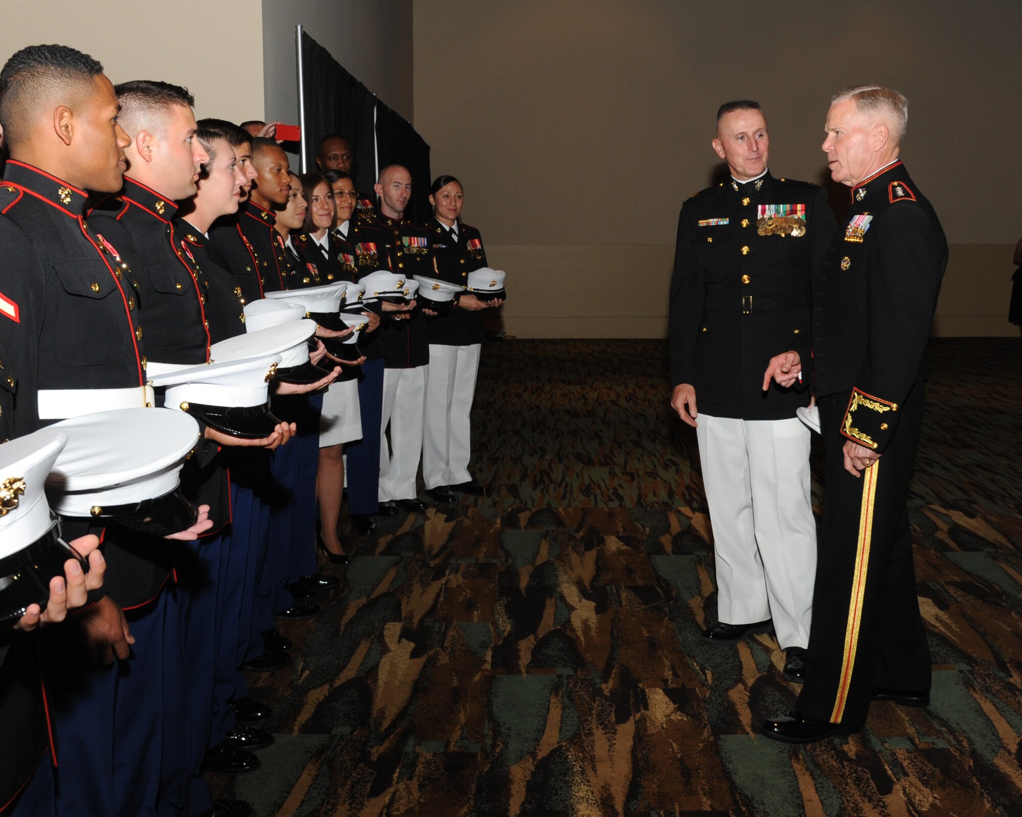 U.S. Marine Corps Maj. Randall Davis, Keesler Marine Detachment commanding officer, introduces Gen. James Amos, Commandant of the Marine Corps, to members of the Keesler Marine Corps Detachment during the reception of the 35th Annual Salute to the Military Oct. 22, 2013, at the Mississippi Coast Coliseum in Biloxi, Miss.  Amos was the guest speaker for the event.  (U.S. Air Force photo by Kemberly Groue)