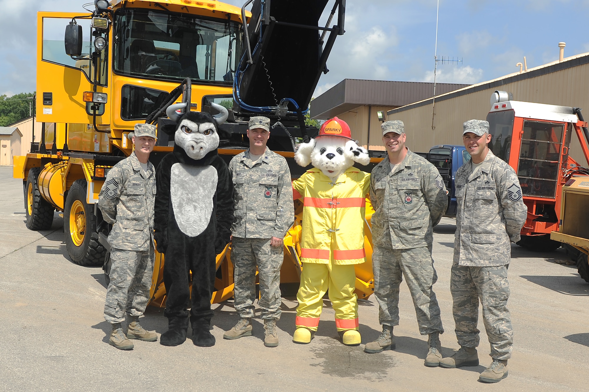 Lt. Col. Novy stands between Perry the Prime Beef Bull and Sparky the dog during the “Back to School” event in the civil engineering compound.  Novy assumed command the 375th Civil Engineer Squadron July 12, 2013.  (U.S. Air Force photo by Senior Airman Divine Cox)