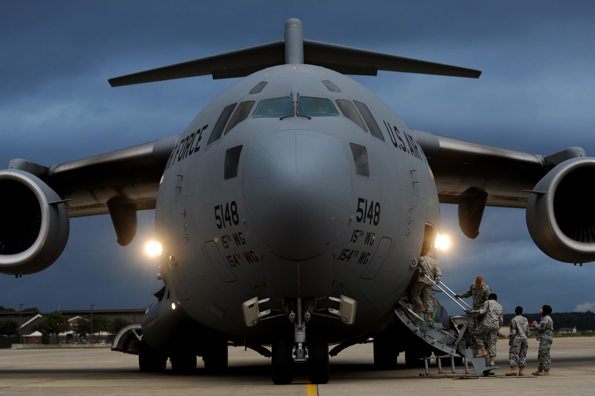 U.S. Army Soldiers from the 622nd Movement Control Detachment from Fort Eustis, Va., board a C-17 Globemaster III during an unloading mission at Langley Air Force Base, Va., Oct. 23, 2013. The Soldiers partnered with Airmen from the 633rd Logistics Readiness Squadron to learn how to properly unload large airframes. (U.S. Air Force photo by Staff Sgt. Jarad A. Denton/Released) 