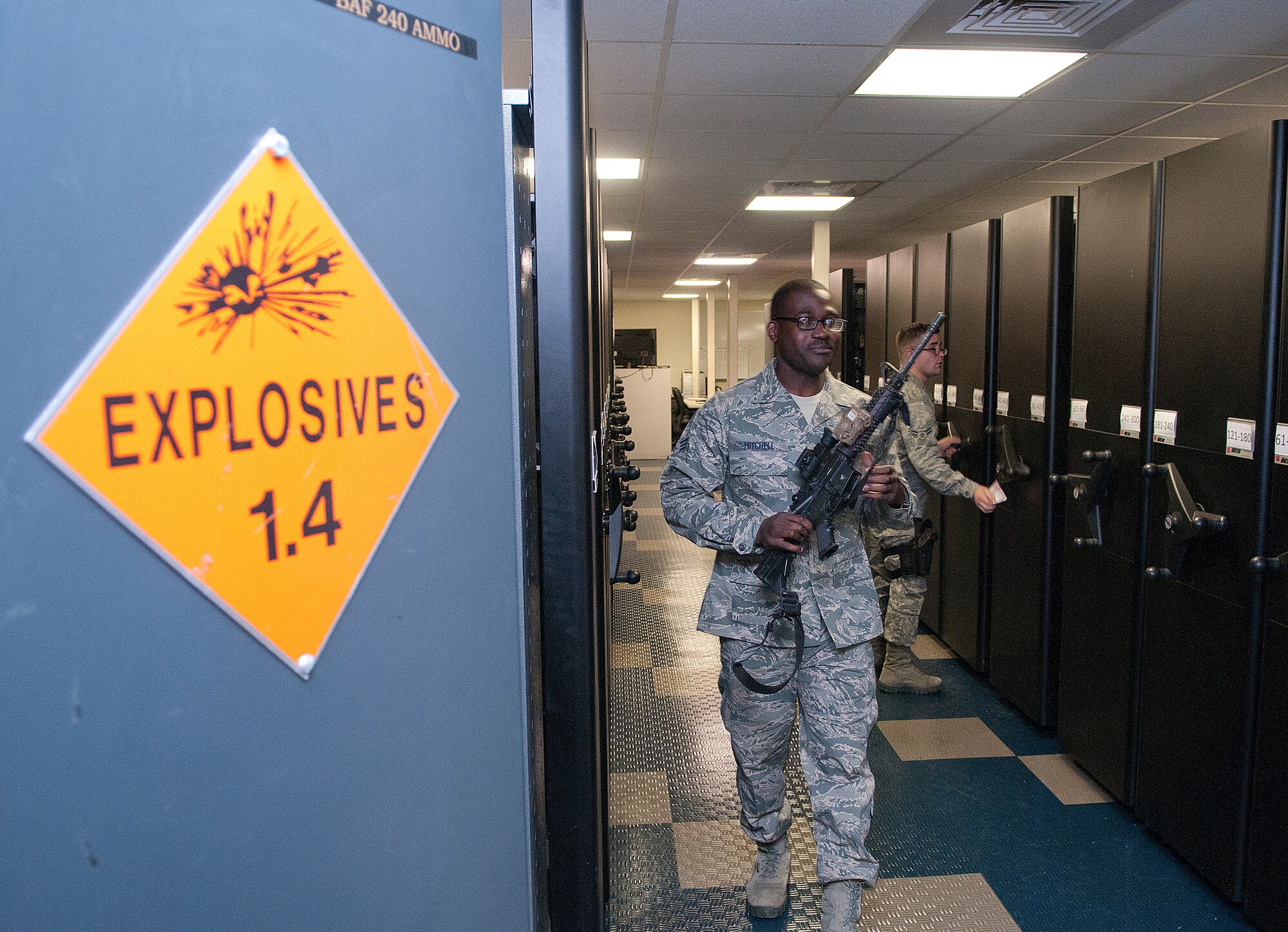 131021-F-JW079-118
Senior Airman Randall Mitchell, 90th Security Support Squadron, carries an M4 rifle to the F.E. Warren Air Force Base, Wyo., armory’s front window for issue Oct. 21, 2013. (U.S. Air Force photo by R.J. Oriez)
