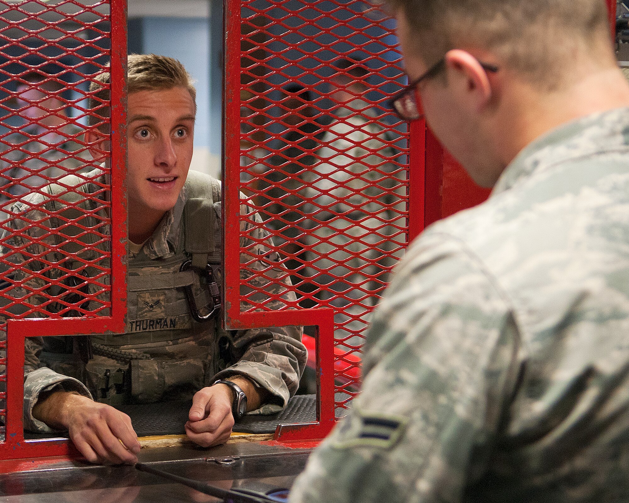 131021-F-JW079-050
Airman 1st Class Kristopher Thurman, 90th Security Forces Squadron, gives information to Airman 1st Class Daniel Deegan, 90th SFS, so Thurman can be issued a weapon from the 90th Security Support Squadron armory Oct. 21, 2013. (U.S. Air Force photo by R.J. Oriez)
