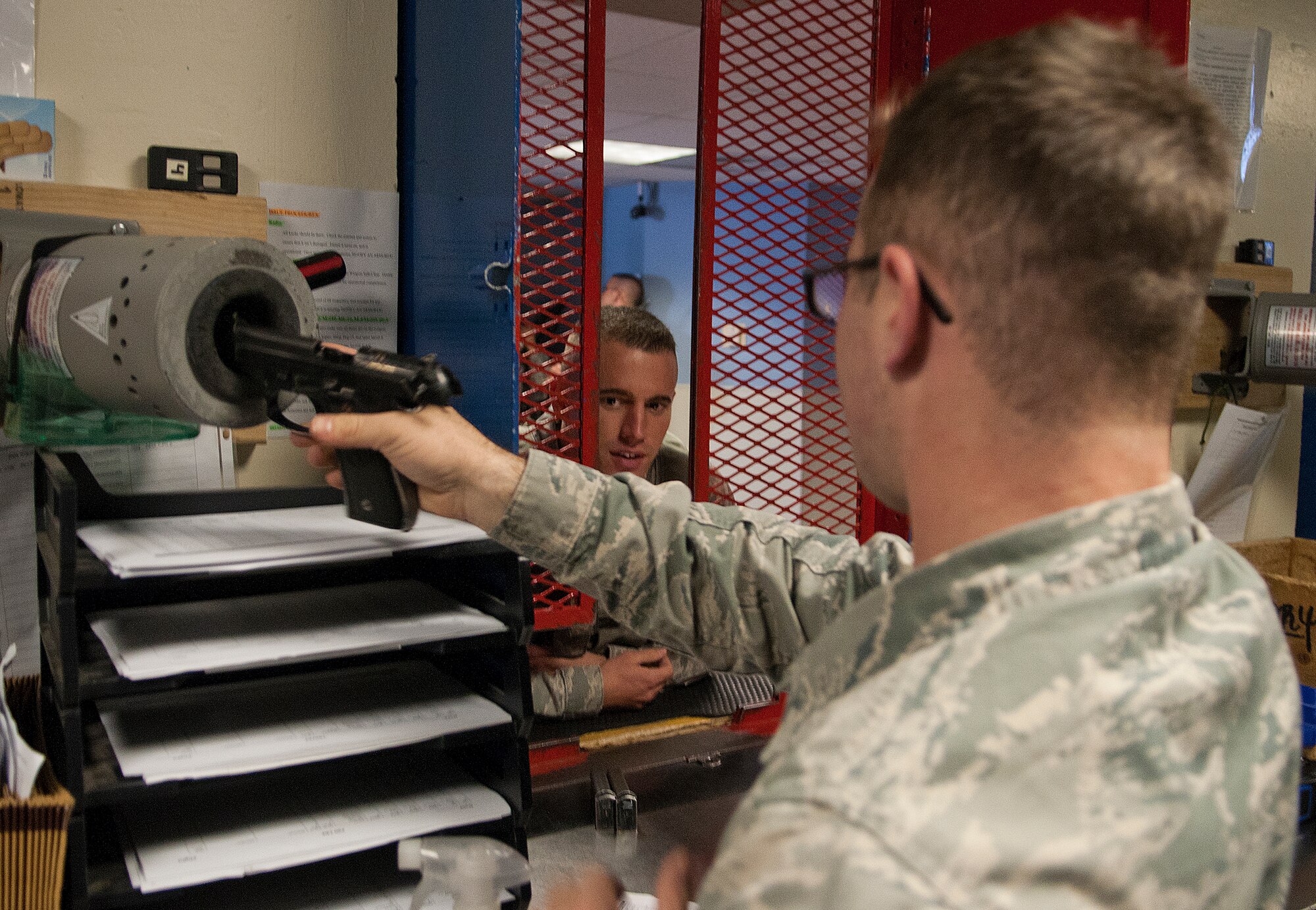 131021-F-JW079-032
Airman 1st Class Daniel Deegan, 90th Security Forces Squadron, clears an M9 pistol in the 90th Security Support Squadron armory before issuing it to Airman 1st Class Kristopher Thurman, 90th SFS Oct. 21, 2013. Most security forces flights on F.E. Warren Air Force Base, Wyo., have their own additional-duty armorers who assist the armory personnel support the flight. (U.S. Air Force photo by R.J. Oriez)

