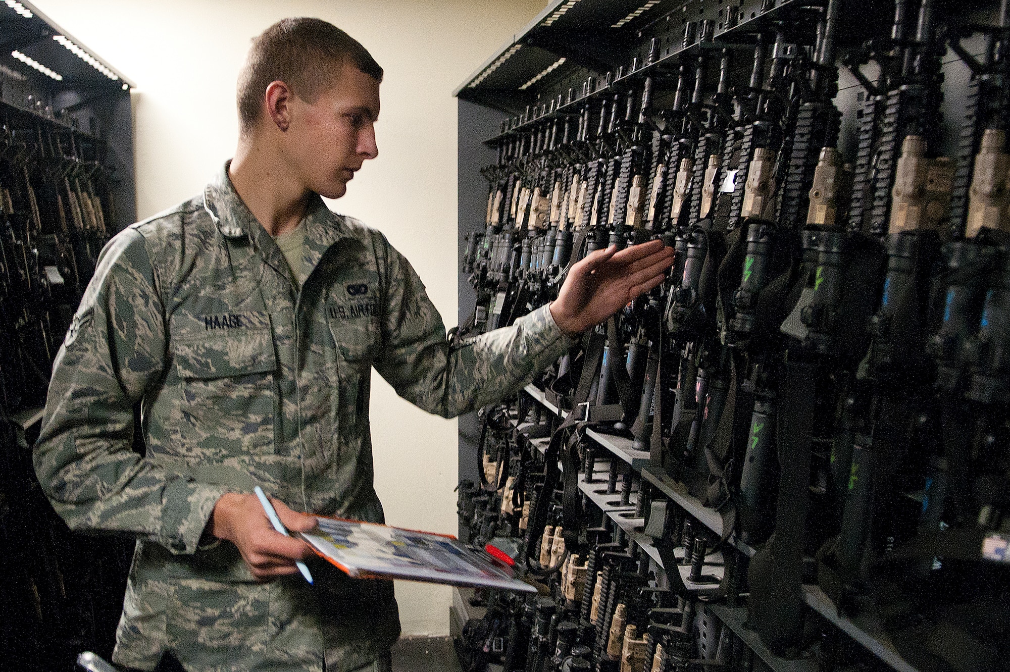131021-F-JW079-004
Airman 1st Class Kurt Haage, 90th Security Support Squadron, inventories M4 rifles at the start of his shift in the armory on F.E. Warren Air Force Base, Wyo., Oct. 21, 2013. Each of the more than 1,600 weapons in the armory must be accounted for at the start of each 12-hour shift. (U.S. Air Force photo by R.J. Oriez)
