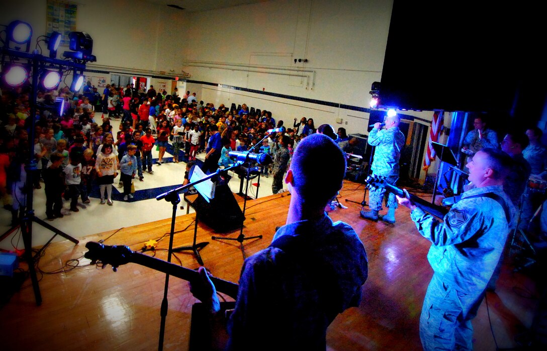 USAF Band Full Spectrum performed at Armstrong Elementary in Hampton, VA as part of a social studies project. Students from Armstrong Elementary recorded a video greeting in April 2013 to students in Kyrgyzstan. Full Spectrum delivered the greeting during a recent deployment performance in Kyrgyzstan. On today, Full Spectrum returned to Armstrong Elementary for an encore performance and to deliver a video message from the students in Kyrgyzstan. The 45 minute presentation was well received.