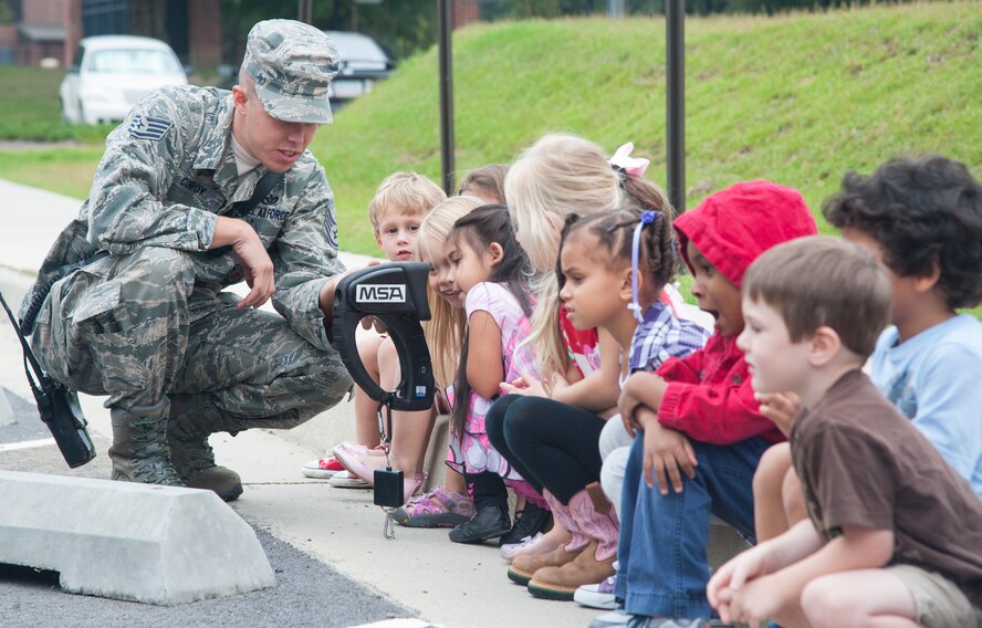 U.S. Air Force Staff Sgt. Chris Conroy, 23d Civil Engineer Squadron firefighter, gives a demonstration to children at the Child Development Center at Moody Air Force Base, Ga., Oct. 9, 2013. The demonstration showed what thermal vision looks like through smoke. (U.S. Air Force photo by Airman Dillian Bamman/Released)
