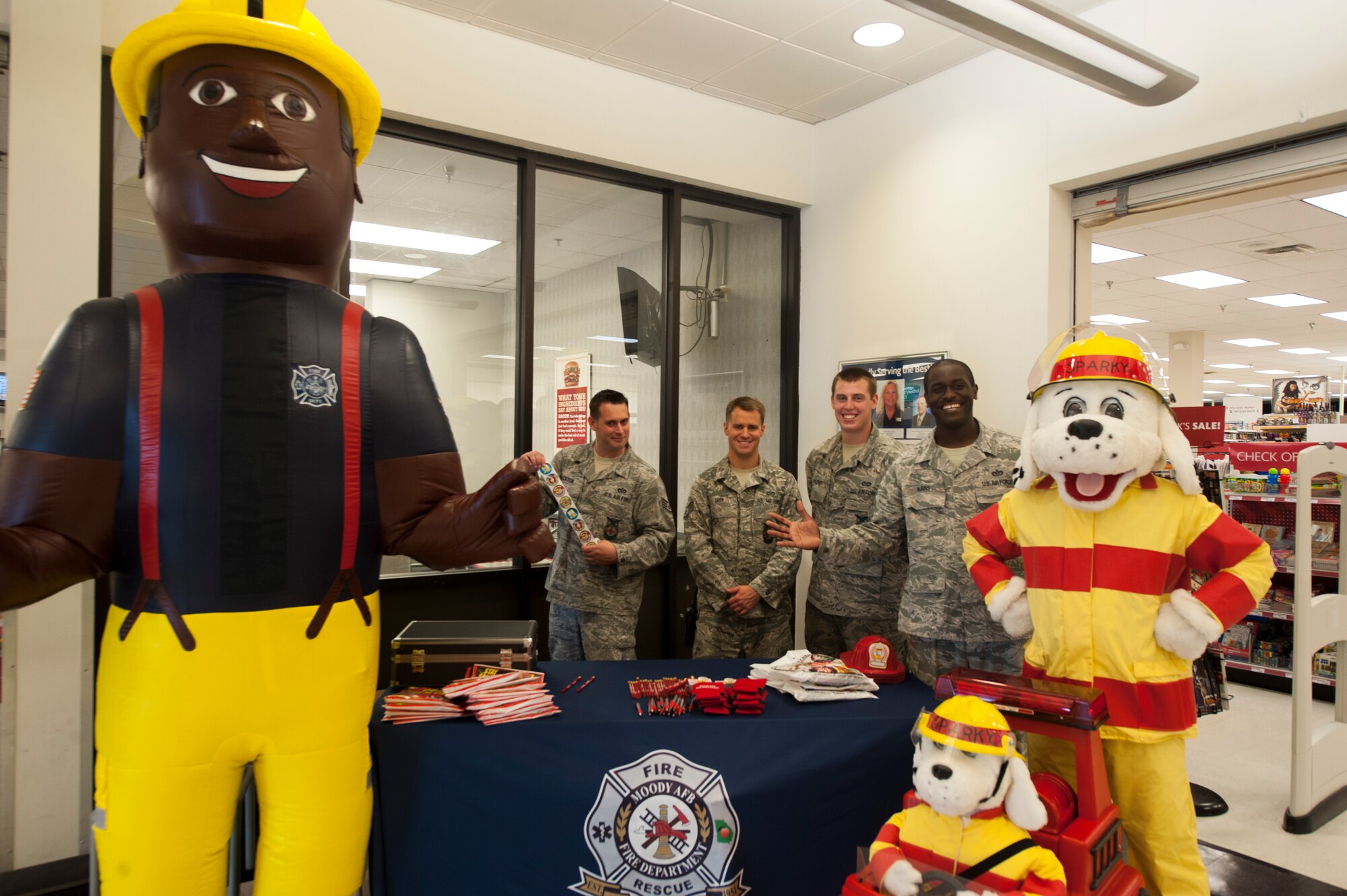 The 23d Civil Engineer Squadron Fire Department kicks off Fire Prevention Week at the Base Exchange on Moody Air Force Base, Ga., Oct. 7, 2013. Every year, Sparky and the 23d CES Fire Department visit the Moody Child Development Center and Youth Center to teach children about fire safety. (U.S. Air Force photo by Airman Dillian Bamman/Released)