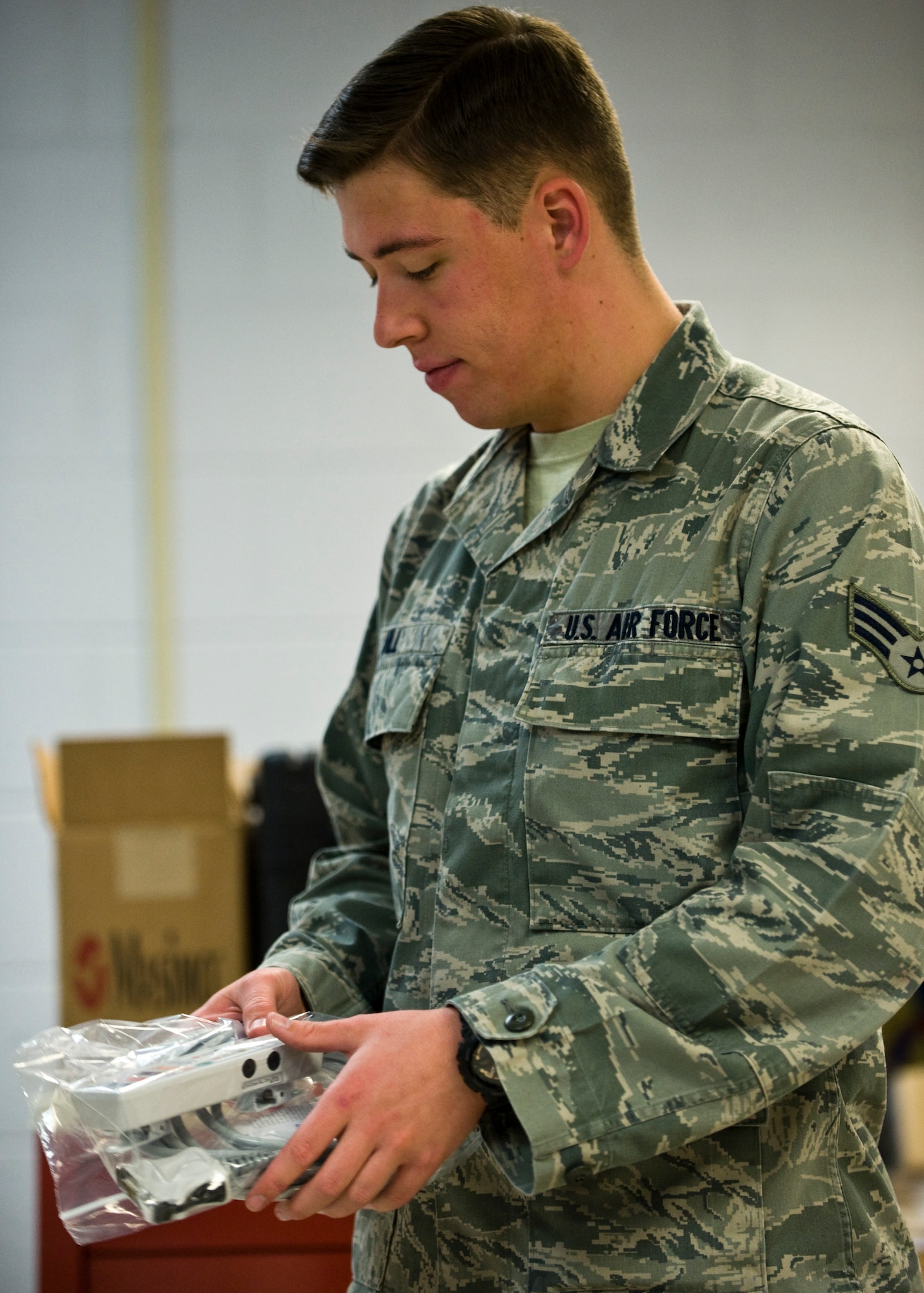 Senior Airman Dana Hill, 99th Medical Support Squadron biomedical equipment technician, performs an initial biomedical equipment acceptance inspection for a nerve integrity monitoring system component at the Mike O’Callaghan Federal Medical Center, Oct. 17, 2013, at Nellis Air Force Base, Nev.  The 99th MDSS receives medical equipment valued at $4 million per year and is the largest biomedical equipment flight in Air Combat Command. (U.S. Air Force photo by Airman 1st Class Jason Couillard)