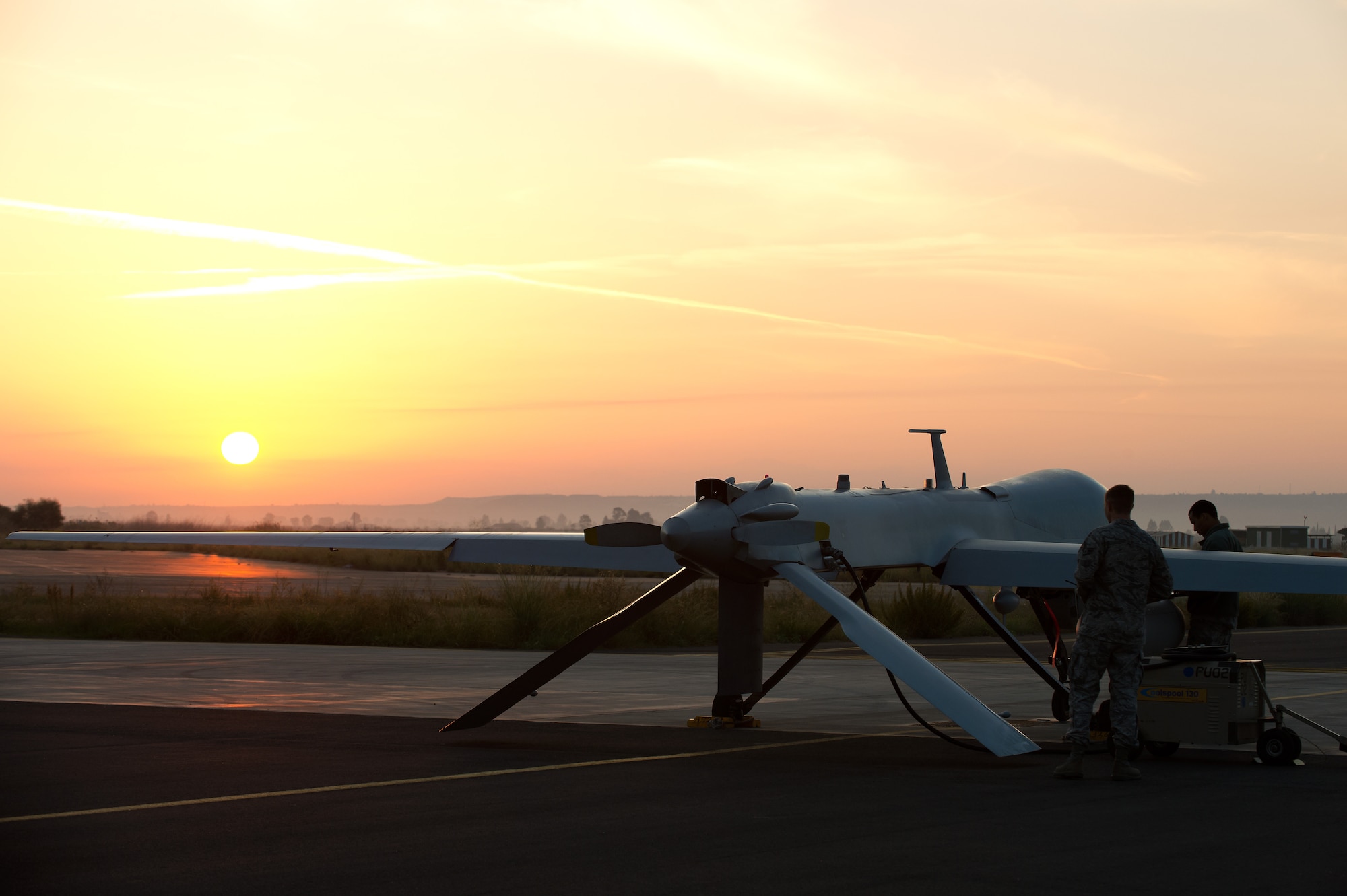 Airmen attached to the 324th Expeditionary Reconnaissance Squadron, based out of 432nd Wing/432nd Air Expeditionary Wing at Creech Air Force Base, Nev., perform a preflight inspection on an MQ-1 Predator remotely piloted aircraft as the wing passed the 2 million flying hour milestone Oct. 22, 2013. Since initial operations began in 1995 to April 2011 the wing flew their first 1 million hours. Due in large part to total force integration efforts and an expansion of combat air patrols the 2 million hour mark was achieved 32 months later, culminating in more than 215,000 total missions completed and nearly 94-percent of all missions flown in support of major combat operations. (U.S. Navy photo by Mass Communication Specialist 2nd Class Brian T. Glunt/Released)