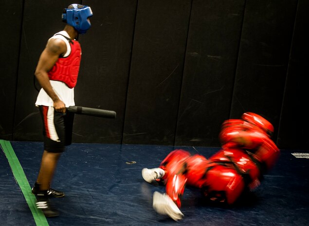 Senior Airman Martin Jackson, 628th Security Forces Squadron patrolman, uses self-defense techinques to imobilize a Redman “aggressor” during a Phoenix Raven training session Oct. 10, 2013, at Joint Base Charleston, S.C. The Redman training sessions lasted for approximately a minute with each trainee having to fight off two attackers. Jackson and two other security forces members went through a three-week course at the JB Charleston Phoenix Raven facility to prepare them for the Phoenix Raven training course at the United States Air Force Expeditionary Center at Joint Base McGuire-Dix-Lakehurst, N.J. (U.S. Air Force photo/ Senior Airman Dennis Sloan)