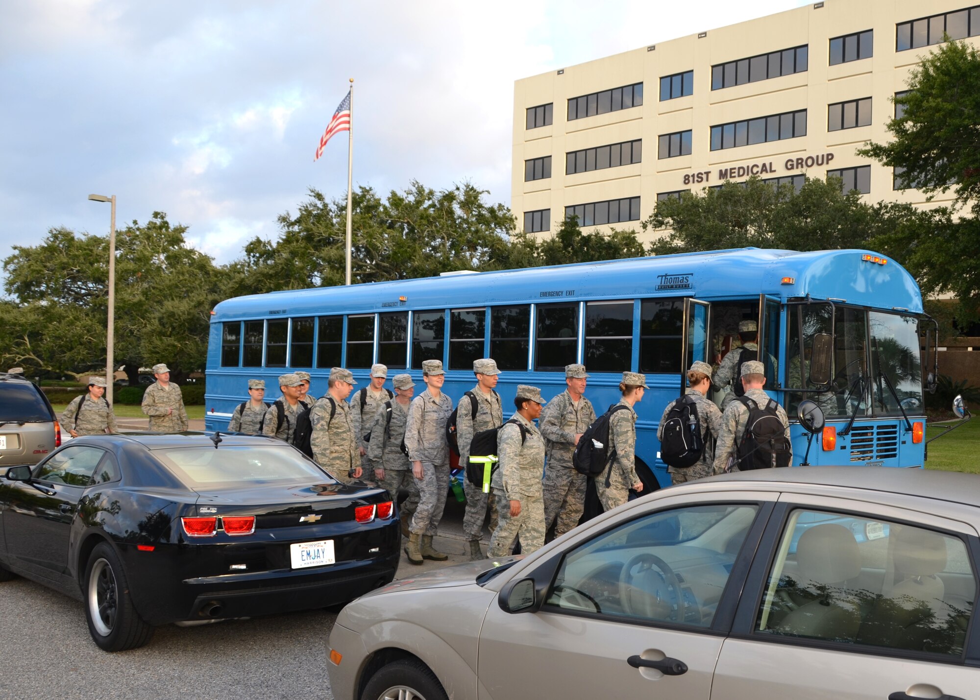 Medics board a bus departing for the deployment line at Roberts Maintenance Center Oct. 9 during the second day of a deployment exercise which tested the response to a short-notice deployment notification.  Twenty-nine “Dragon Medics” and their equipment simulated processing and boarding aircraft.  The event began with an early-morning recall Oct. 8.