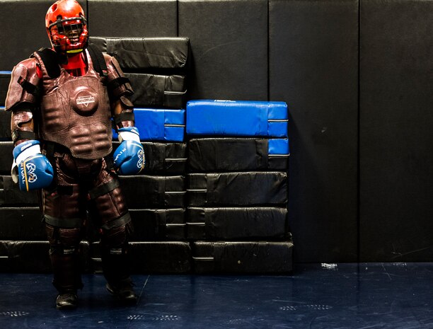 Tech Sgt. Anthony Clay, 628th Security Forces Squadron Phoenix Raven instructor, waits on the side of a mat while wearing the Redman suit used to simulate an “aggressor” during a Phoenix Raven training session Oct. 10, 2013, at Joint Base Charleston, S.C. Blair and several other Phoenix Raven instructors put three security forces members through a three-week course at the JB Charleston Phoenix Raven facility to prepare them for the Phoenix Raven training course at the United States Air Force Expeditionary Center at Joint Base McGuire-Dix-Lakehurst, N.J. (U.S. Air Force photo/ Senior Airman Dennis Sloan)