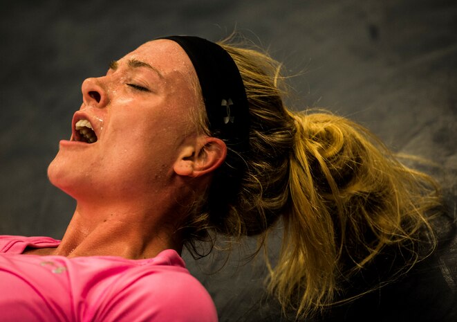 Senior Airman Cheyanne Thoma, 628th Security Forces Squadron patrolman, yells out responses to Phoenix Raven based questions while performing flutter kicks during a Phoenix Raven training session Oct. 10, 2013, at Joint Base Charleston, S.C. Thoma and two other security forces members went through a three-week course at the JB Charleston Phoenix Raven facility to prepare them for the Phoenix Raven training course at the United States Air Force Expeditionary Center at Joint Base McGuire-Dix-Lakehurst, N.J. (U.S. Air Force photo/ Senior Airman Dennis Sloan)