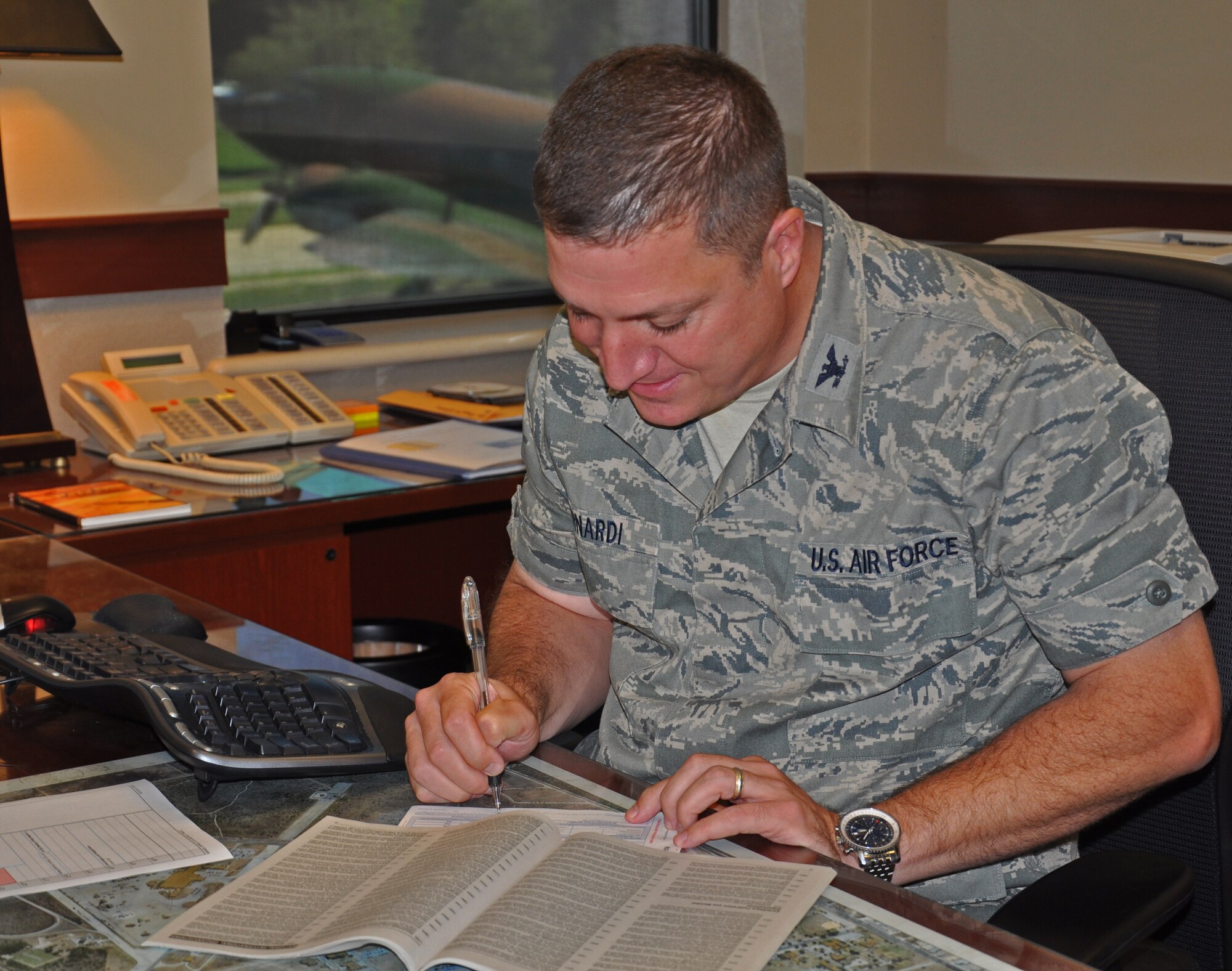 GOODFELLOW AIR FORCE BASE, Texas- Col. Dominic Bernardi, 17th Mission Support Group Commander, fills out a Combined Federal Campaign enrollment sheet here Oct. 23. The CFC resumes full contact operations after its temporary suspension during the government shutdown. (U.S. Air Force photo/ Airman 1st Class Erica Rodriguez) 