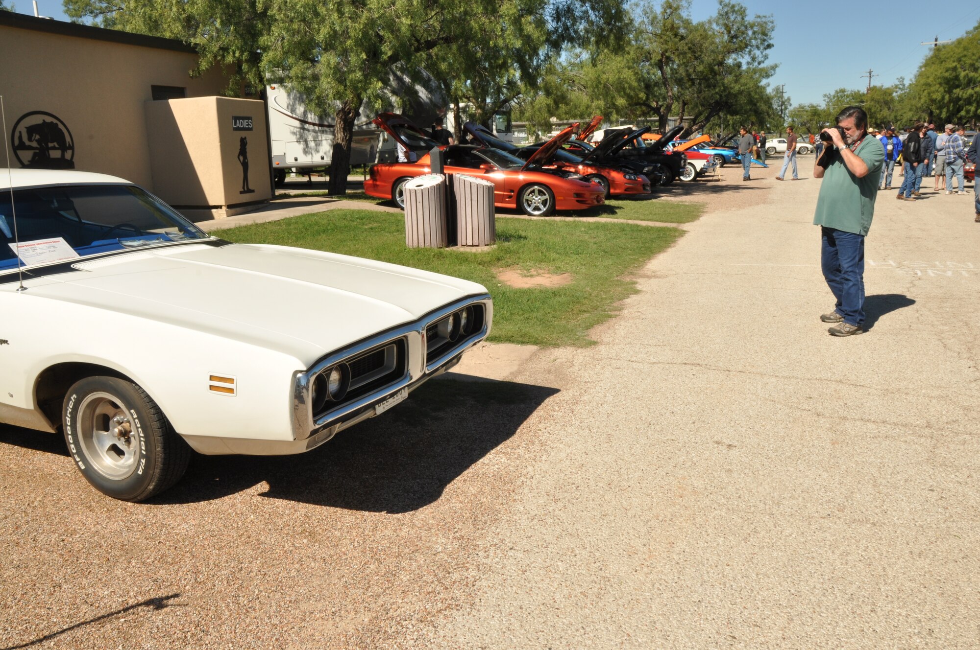 GOODFELLOW AIR FORCE BASE, Texas – Stephen Horton, car show competitor, photographs a 1971 Dodge Charger at the 15th Annual Goodfellow Air Force Base Recreation Camp Car, Boat and Motorcycle Show at the Goodfellow Rec Camp Oct. 19. Horton not only entered a 2001 Chevrolet Corvette into the competition he also came to the show to take photos. (U.S. Air Force photo/ Airman 1st Class Joshua Edwards)