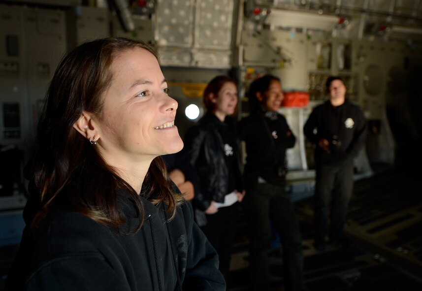 Melissa Berkhoff, member of the Army of Darkness motorcycle endurance racing team and certified motorcycle mechanic, listens to a briefing inside a C-17A Globemaster III during the team’s visit to Dover Air Force Base, Del., Oct. 21, 2013. Berkhoff and her team members talked with Air Force motorcycle riders and shared lessons about teamwork, resiliency and safety. The team has seven world championships and is a consistent points leader during races. (U.S. Air Force photo/Greg L. Davis)