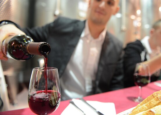Airman 1st Class Robert Maxwell, 31st Fighter Wing command post representative, pours a glass of wine during a responsible drinking event, Oct. 18, 2013, at Gelisi’s Winery in San Quirino, Italy. More than 30 Airmen participated in an evening of free wine, food and round-trip transportation to an Italian vineyard to help understand the affects alcohol can have on an individual. (U.S. Air Force photo/Airman Ryan Conroy) 