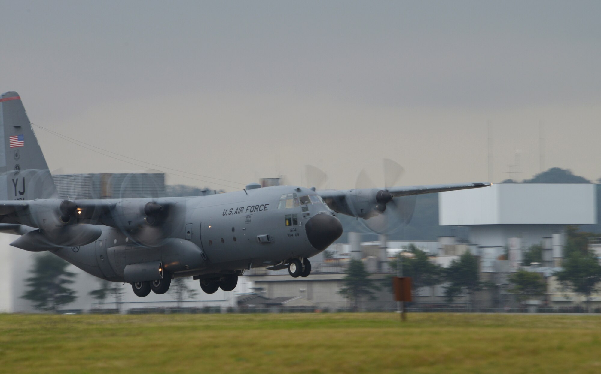 A C-130 Hercules takes flight from Yokota Air Base, Japan, Oct. 22,2013. Aircraft from the 36th Airlift Squadron were launched en masse as part of a large formation mission. (U.S. Air Force photo by Airman 1st Class David Danford/Released)