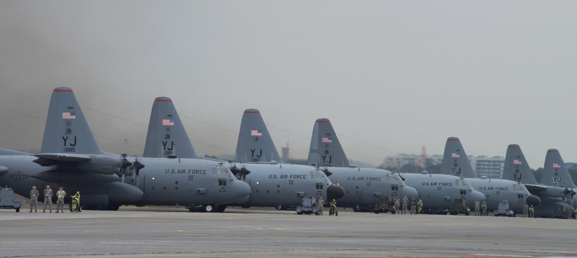 Airmen from the 374th Maintenance Squadron prepare 10 C-130 Hercules for a large formation mission at Yokota Air Base, Japan, Oct. 22, 2013. As the Western Pacific airlift hub, Yokota relies on its maintainers for continued mission readiness. (U.S. Air Force photo by Airman 1st Class David Danford/Released)