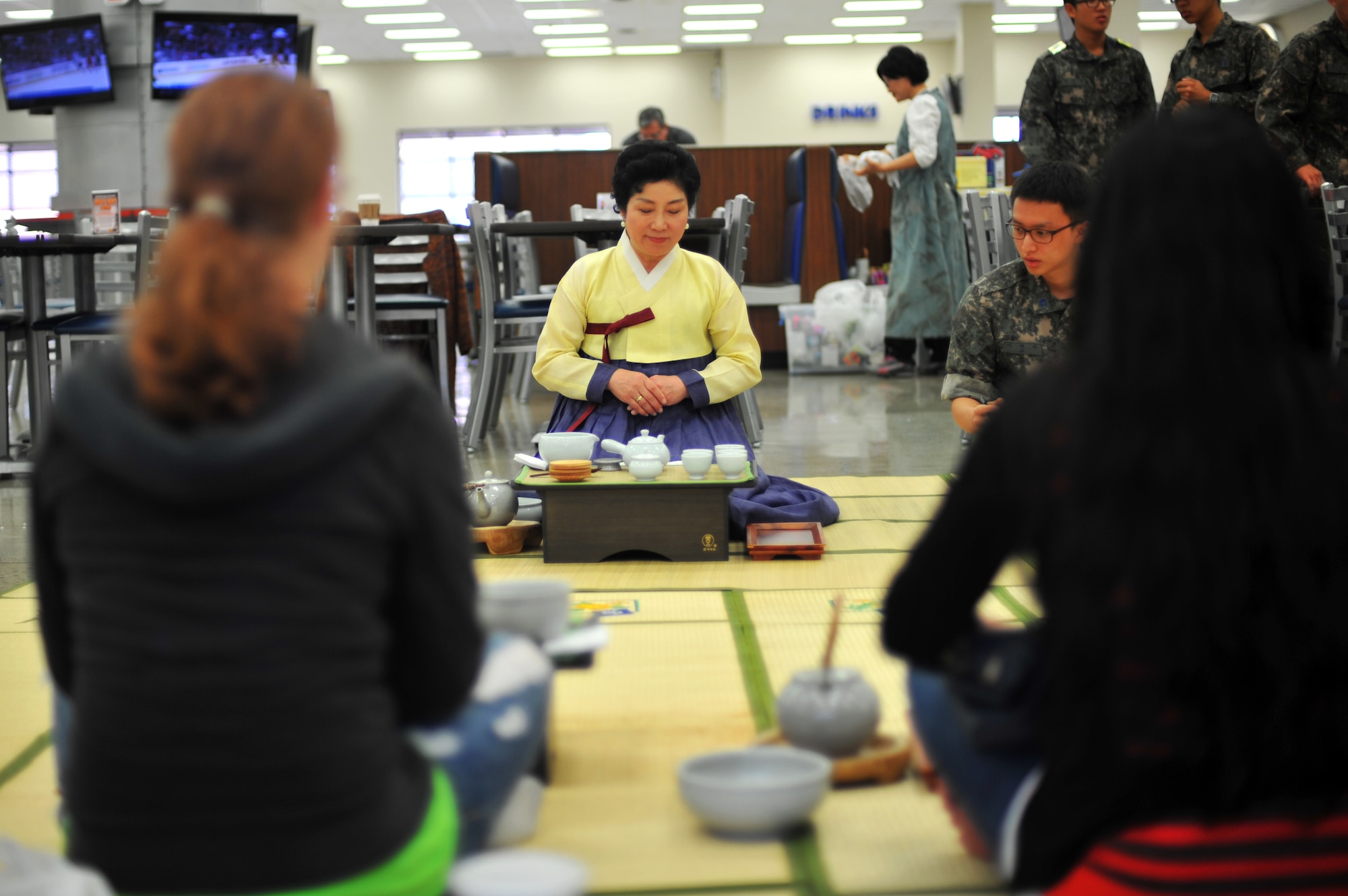Kum Hee Park, traditional tea culture and customs teacher, demonstrates the proper tea drinking procedures for a traditional Korean tea ceremony at Osan Air Base, Republic of Korea, Oct. 23, 2013. Park and other teachers came from the Bosean traditional tea museum for the demonstration. (U.S. Air Force photo/Staff Sgt. Emerson Nuñez)