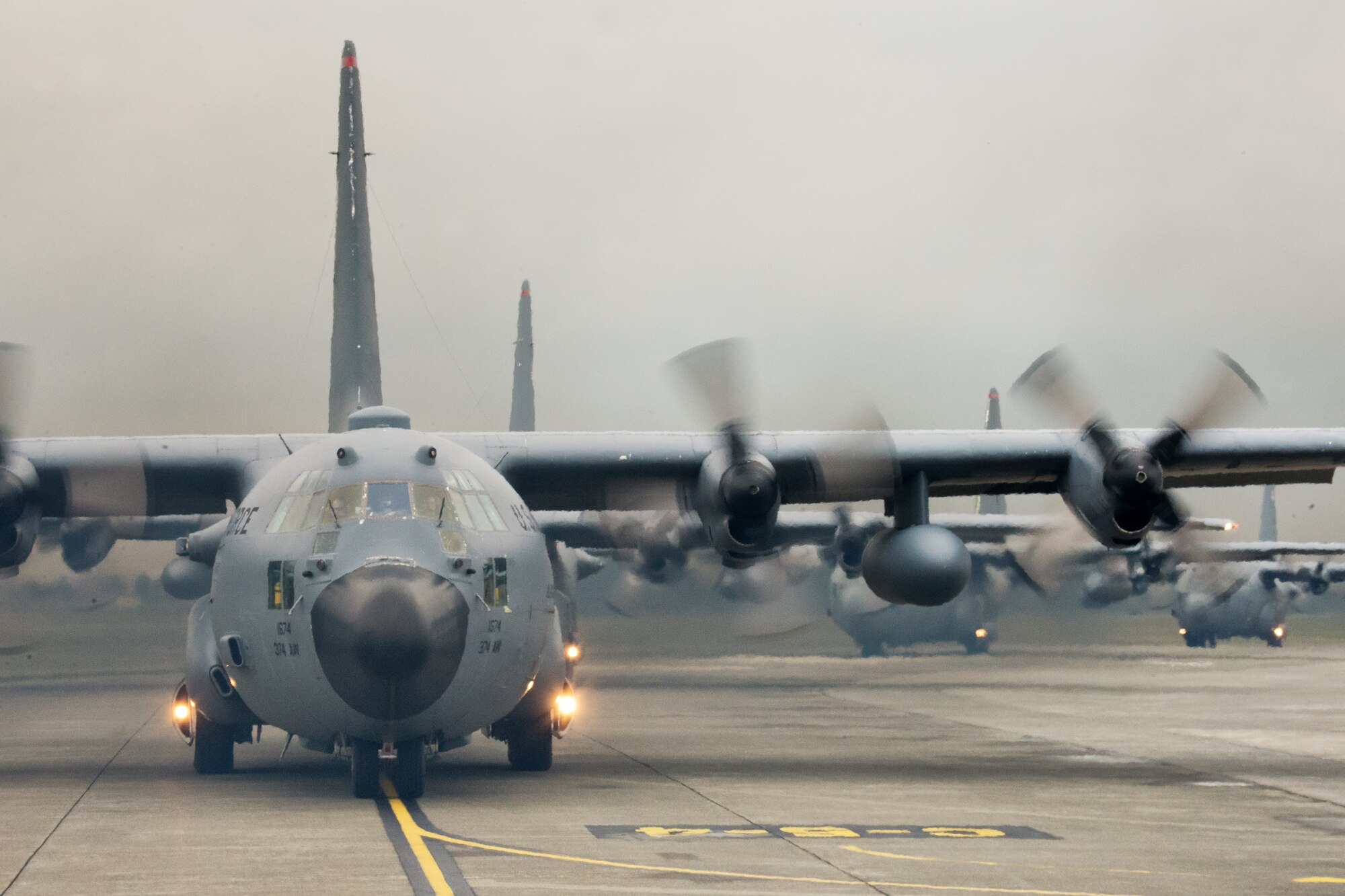 Ten C-130 Hercules from the 36th Airlift Squadron taxi out for a training mission during a ten-ship sortie at Yokota Air Base, Japan, Oct. 22, 2013. The training tested Yokota's ability to perform large-force employment and tactics. (U.S. Air Force photo by Osakabe Yasuo/Released)