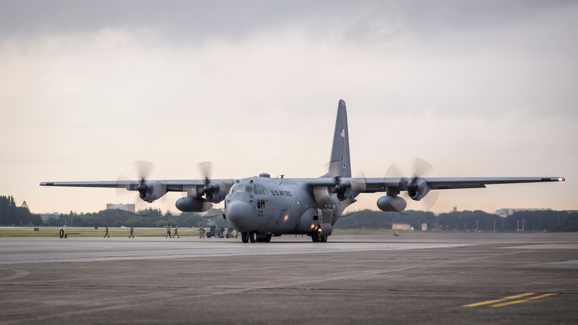 A C-130 Hercules prepares to launch during a large-formation mission at Yokota Air Base, Japan, Oct. 22, 2013. Preparing a large formation requires the combined efforts of all Yokota Airmen, working in tandem to ensure aircraft and crews are prepared to provide support throughout the Pacific region. (U.S. Air Force photo by Captain Raymond Geoffroy/Released)