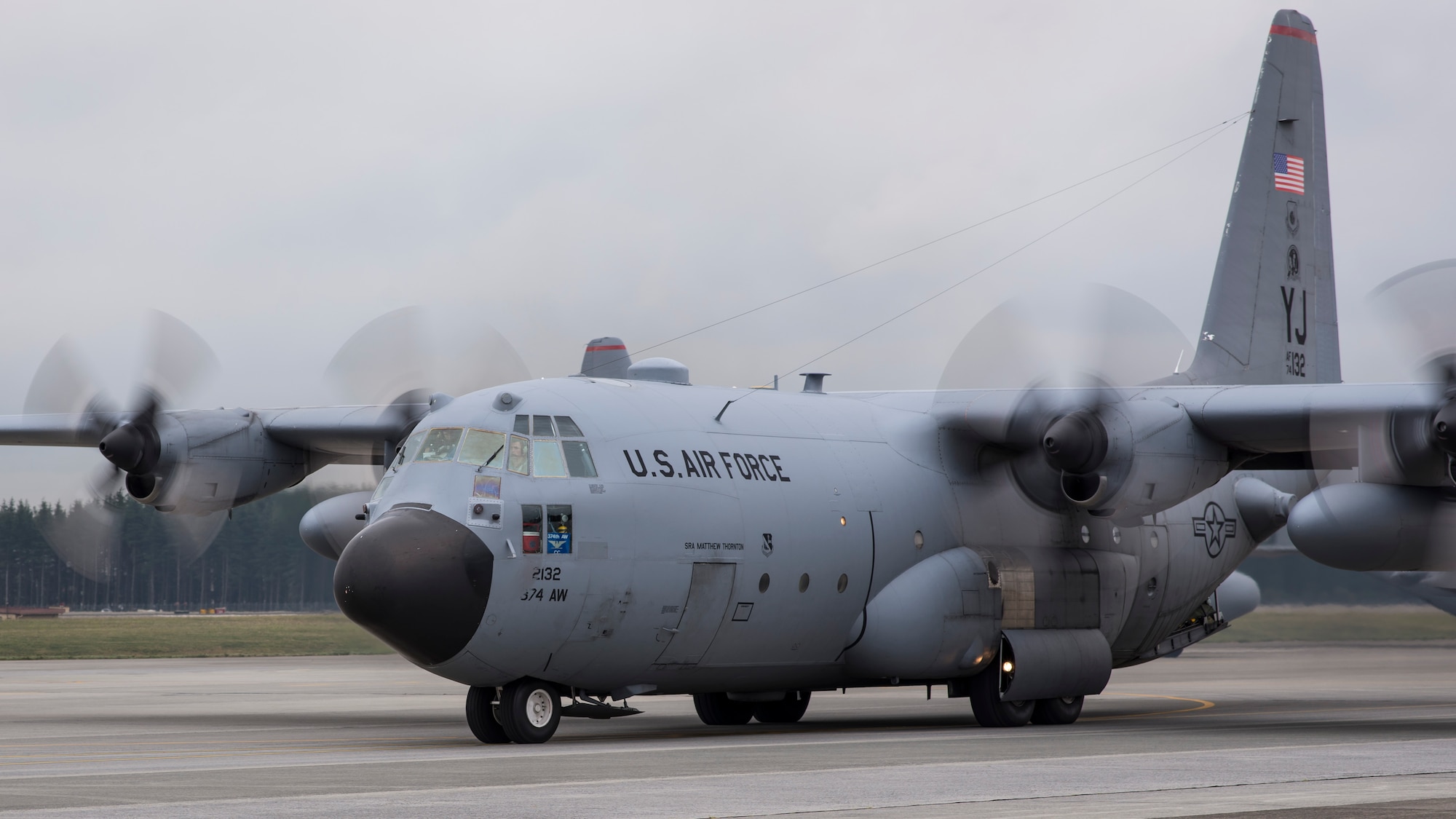Col. Mark August, 374th Airlift Wing commander, taxis to the front of a 10 C-130 Hercules formation during a training mission at Yokota Air Base, Japan, Oct. 22, 2013. During this mission, Team Yokota launched every aircraft currently stationed at Yokota. (U.S. Air Force photo by Captain Raymond Geoffroy/Released)