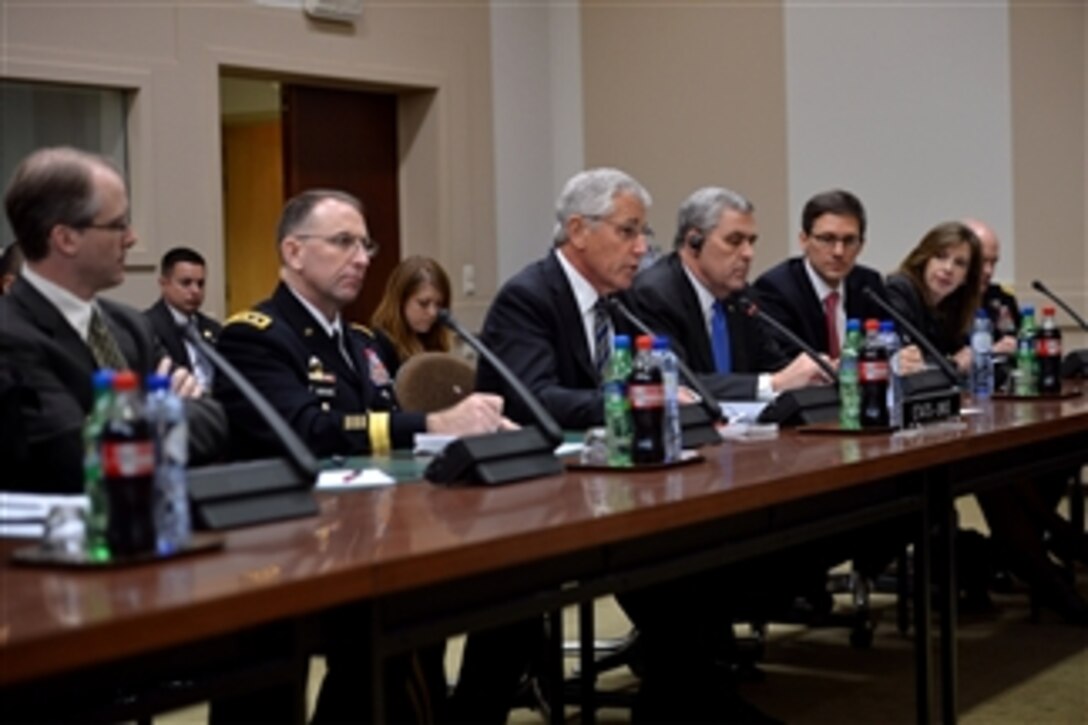 Secretary of Defense Chuck Hagel, third from left, meets with Russian Minister of Defense Sergey Shoygu after a meeting of the non-NATO International Security Assistance Force contributing nations at NATO headquarters in Brussels, Belgium, on Oct. 23, 2013.  Hagel is meeting with NATO defense ministers to discuss post-2014 Afghanistan, prepare for next year’s NATO summit in the United Kingdom, and discuss the role of NATO in the coming years.   