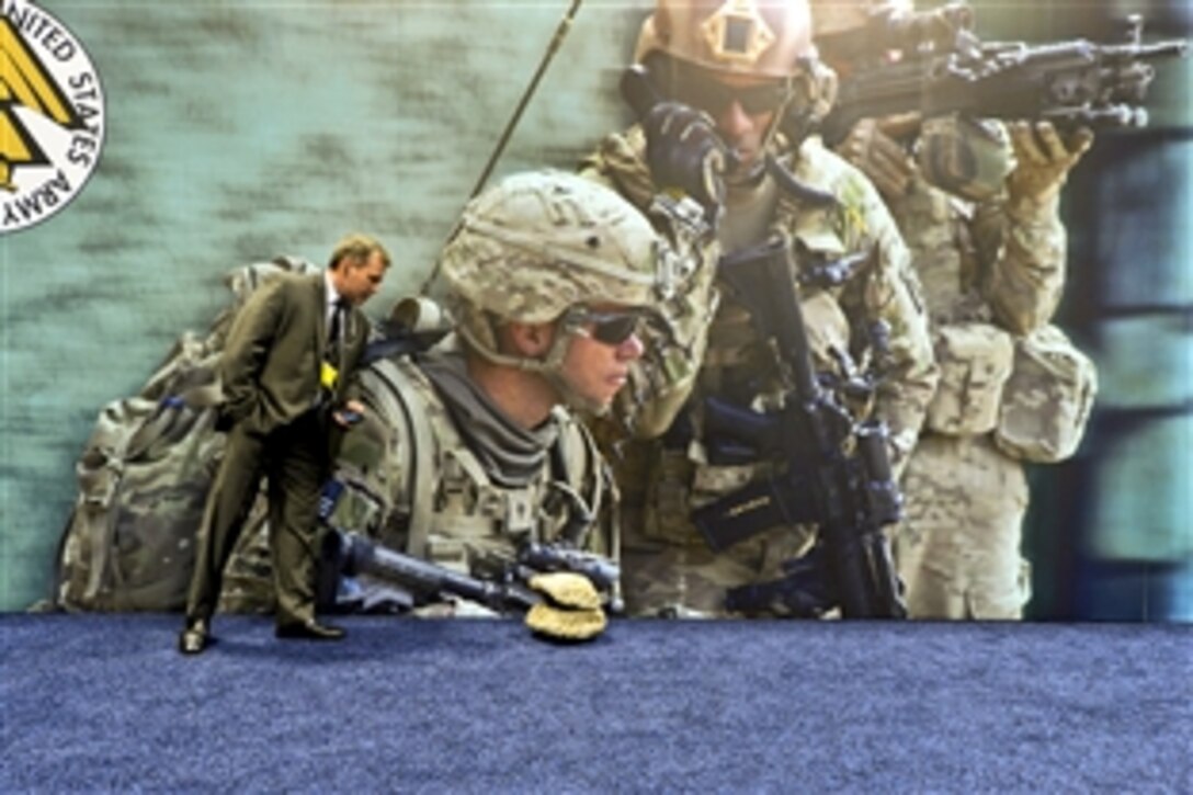 A vendor views a video camera concealed in a fake rock during the Association of the U.S. Army's annual meeting and exposition in Washington, D.C., Oct. 22, 2013. 