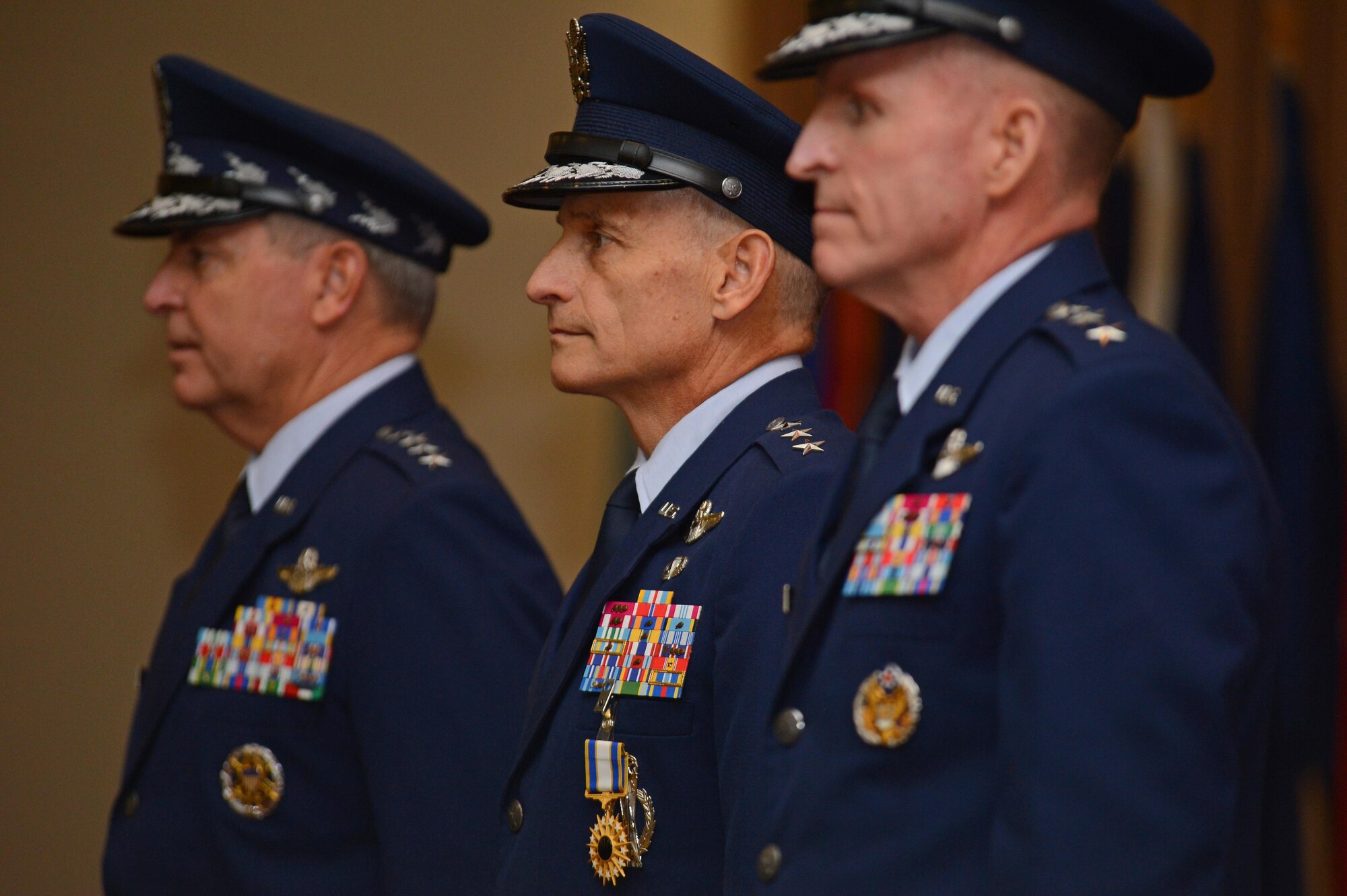 Air Force Chief of Staff Gen. Mark A. Welsh III, (from left) Lt. Gen. Jim Kowalski, outgoing Air Force Global Strike Command commander; and Lt. Gen. Stephen Wilson, new Global Strike Command commander, stand at attention during reading of the orders for the command's change of command, Oct. 23, 2013. The Global Strike mission is to develop and provide combat ready forces for safe, secure and effective nuclear deterrence and global strike operations to support the President of the United States and combatant commanders. 