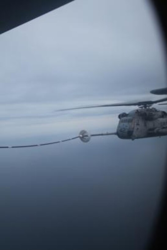 A CH-53E Super Stallion belonging to Marine Heavy Helicopter Squadron 464 refuels off the Atlantic Coast during training Monday. The Super Stallion received fuel from a KC-130J with Marine Aerial Refueler Transport Squadron 252. The training benefited both squadrons by allowing practice for pilots and crew members.
