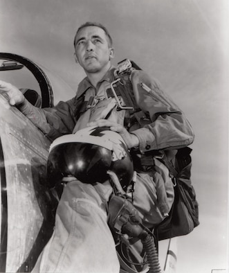 Then-Maj. James Robinson “Robbie” Risner poses with F-86 Sabre in South Korea. Brig. Gen. Risner enlisted in the U.S. Army Air Corps during World War II. He flew more than 108 combat missions in the Korean War, shot down eight MiGs, and became the 20th jet ace of that war. Risner passed away Oct. 22, 2013.