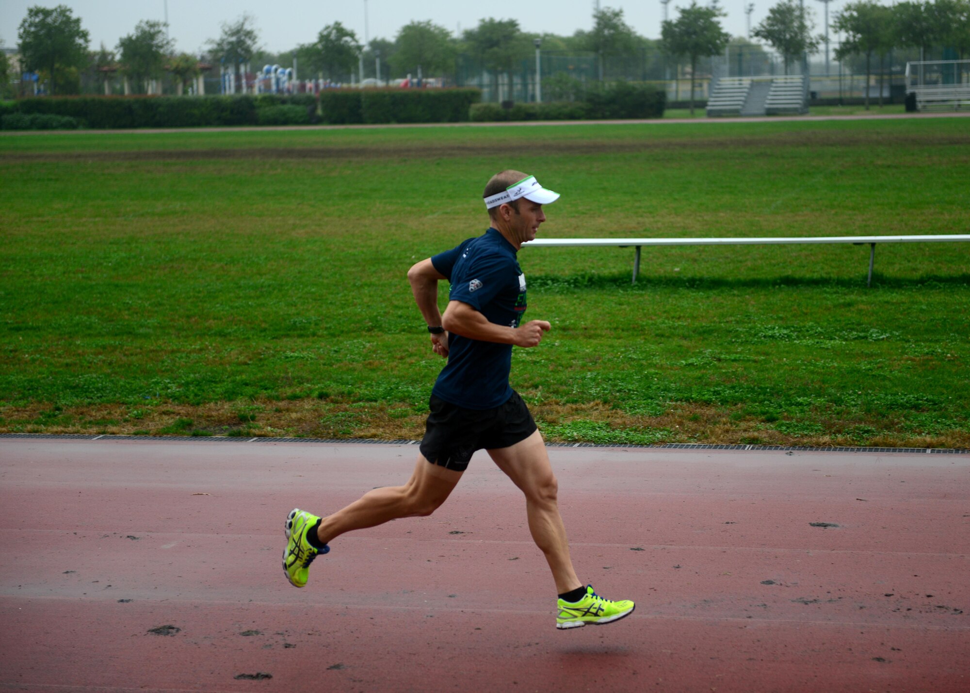 Lt. Col. Scott Poteet runs on the track Oct. 23, 2013, at Aviano Air Base, Italy. Poteet recently completed the 2013 Ironman World Championship in Kailua-Kona, Hawaii, where he ranked 343 out of 2,134 participants. Poteet is the 31st Operations Group deputy. 