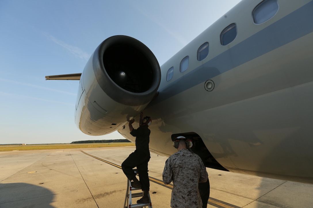 Members of Marine Transport Squadron 1 conduct engine maintenance on a C-9B Skytrain on Cherry Point Oct. 17 after its return from a routine mission.  VMR-1 is the only squadron in the Marine Corps to maintain and fly the aircraft.