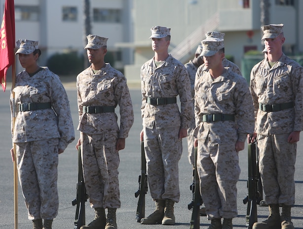 Marines with Ammunition Company, 1st Supply Battalion, Combat Logistics Regiment 15, 1st Marine Logistics Group, stand at attention during a quarterly drill competition aboard Camp Pendleton, Calif., Oct. 18, 2013. The event was designed to sharpen the basics of drill while building morale in the battalion. 