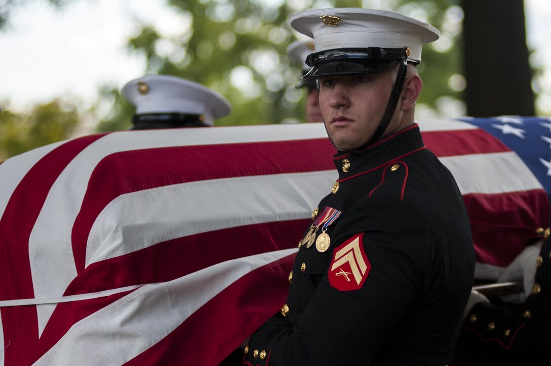 Cpl. Jerry Berning, body bearer from Marine Barracks Washington, D.C., carries a casket during a funeral ceremony at Arlington National Cemetery Oct. 24. The ceremony, supported by the Barracks, was held for a group of six Marines who died in a CH-53 helicopter crash in Afghanistan on January 19, 2012. The deceased are Capt. Daniel Bartle, Capt. Nathan McHone, Master Sgt. Travis Riddick, Cpl. Jesse Stites, Cpl. Kevin Reinhard and Cpl. Joseph Logan.