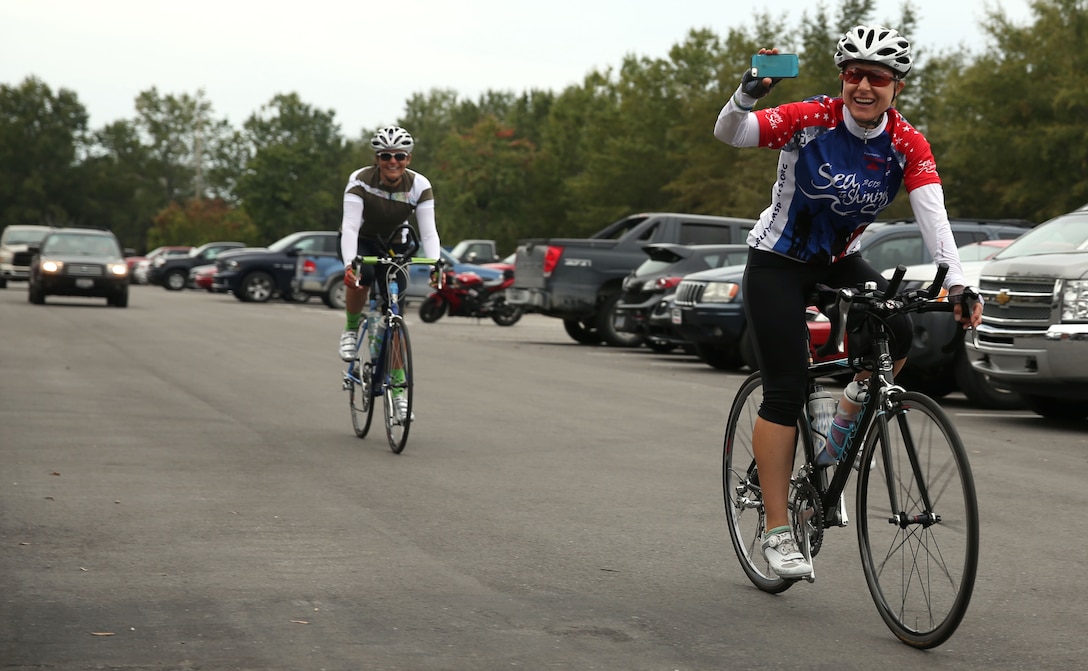 Retired Marine Major Jennifer Marino arrives at 2nd Light Armored Reconnaissance Battalion aboard Marine Corps Base Camp Lejeune, Oct. 22, 2013 after riding from Marine Corps Base Camp Pendleton. Marino retired from the Marine Corps and rode across the country to meet with gold star families.