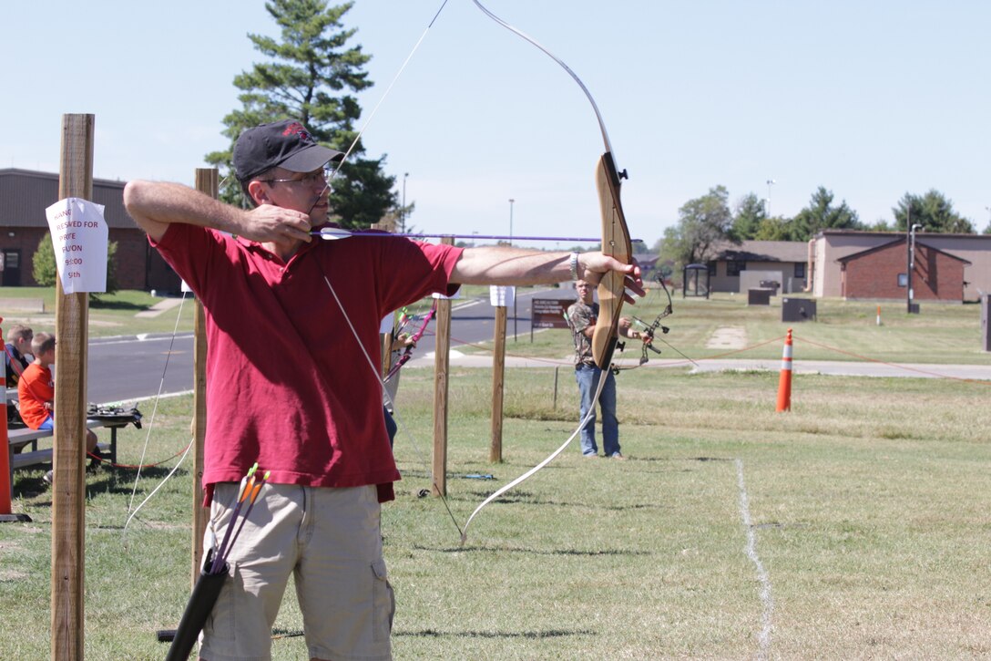 Capt. Michael Williams, 932nd Airlift Wing Protestant Chaplain, shows off his archery skills at the 3D Archery Shoot held during the 932nd AW annual family day. (Air Force photo by Staff Sgt. Meiko Schill.)