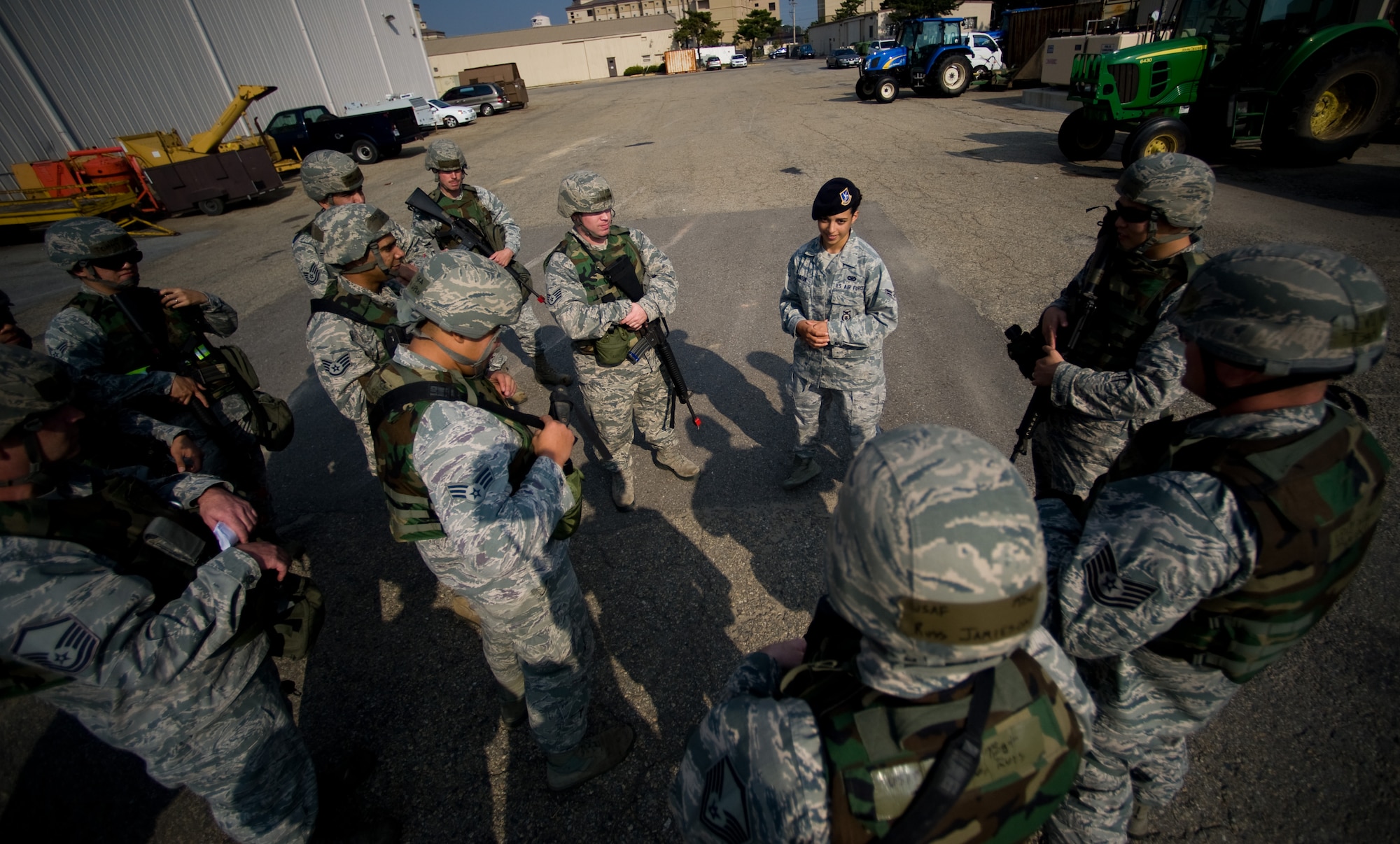 Airman 1st Class Kolina Burton, 8th Security Forces Squadron instructor, takes questions on defensive tactics form the 8th Civil Engineer Squadron at Kunsan Air Base, Republic of Korea, Oct. 24, 2013. Airmen from the 8th CES trained with the 8th SFS on how to defend their compound. The 8th SFS trained the Red Devils on communication tactics, apprehending suspects and manning defensive positions. (U.S. Air Force photo by Senior Airman Armando A. Schwier-Morales/Released)