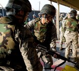 Senior Airman Michael Weiss, 8th Civil Engineer Squadron power pro journeyman, clears his weapon at Kunsan Air Base, Republic of Korea, Oct. 24, 2013. Airmen from the 8th CES trained with the 8th Security Forces Squadron on how to defend their compound. The 8th SFS trained the Red Devils on communication tactics, apprehending suspects and manning defensive positions. (U.S. Air Force photo by Senior Airman Armando A. Schwier-Morales/Released)
