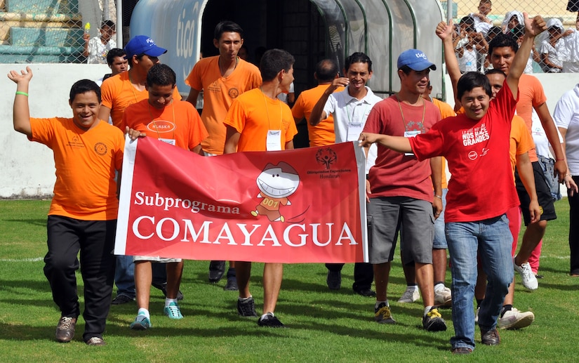 Athletes who will be competing in the Honduras Special Olympics march into Carlos Miranda Stadium, Comayagua, Honduras, during the opening ceremony, Oct. 24, 2013.  Joint Task Force-Bravo is providing support for the Honduras Special Olympics soccer tournament, which will be played at Soto Cano Air Base.  (U.S. Air Force photo by Capt. Zach Anderson)
