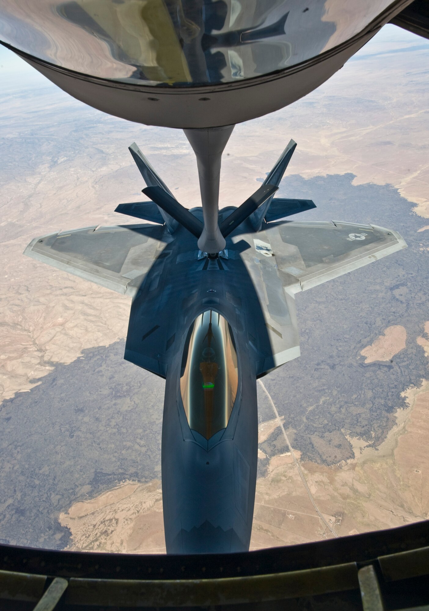 Lt Col. Corbett Peterson, 384th Air Refueling Squadron pilot and deputy officer, taxis a KC-135 Stratotanker along the runway, Oct. 23, 2013, at McConnell Air Force Base Kan. A four ship of tankers refueled four F-22 Raptors assigned to the 49th Fighter Wing, Holloman Air Force Base, N.M. (U.S. Air Force photo/Airman 1st Class John Linzmeier)