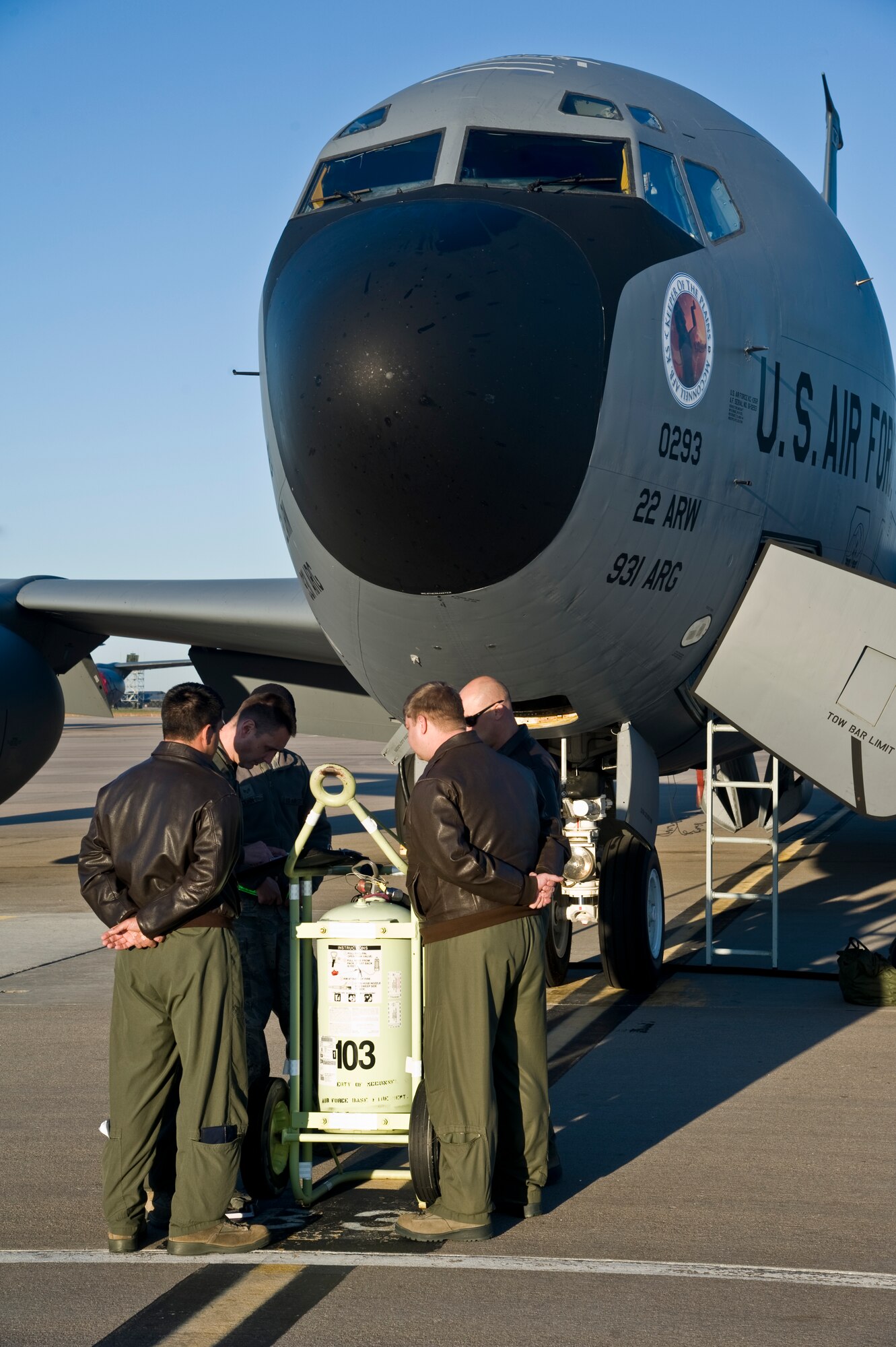 Aircrew from the 384th Air Refueling Squadron discuss preflight checklists, inspection details and procedures, Oct. 23, 2013, at McConnell Air Force Base, Kan., prior to a refueling mission. Communication between aircrew and maintainers is essential for Airmen who place emphasis on by-the-book maintenance, helping keep the KC-135 Stratotanker in the air. (U.S. Air Force photo/Airman 1st Class John Linzmeier)