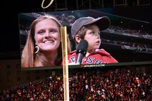BOSTON -- Lindsey Miller holds her 5-year old son Jacoby moments before he declared, "Play Ball" during the pregame ceremony at the start of the 2013 World Series at Fenway Park, Oct. 23. Jacoby was selected to make the ceremonial call based on his father, Capt. Garrett Miller, being deployed from Hanscom Air Force Base to an overseas location. (U.S. Air Force photo by Walter Santos)