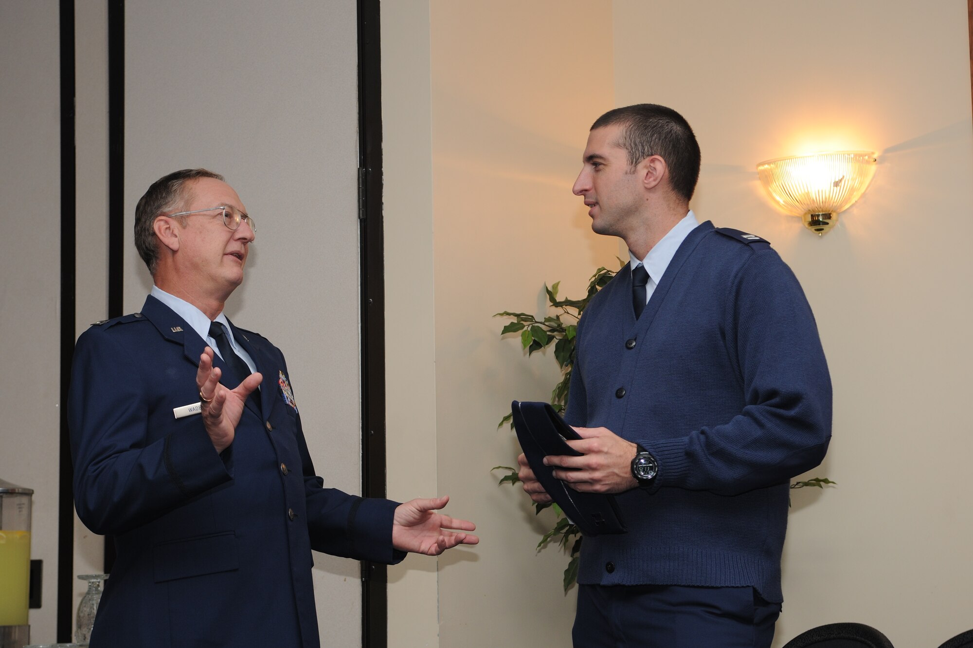 Captains Anthony Wade (left) and Aaron Reynolds (right) discuss the events of a Clergy Appreciation Day banquet held Oct. 22, 2013, at The Club at Andrews at Joint Base Andrews, Md. The banquet is an annual event thanking clergy members for their ministry and spiritual counsel. Wade and Reynolds are chaplains with the 11th Wing. (U.S. Air Force photo/Airman 1st Class Ryan J. Sonnier).