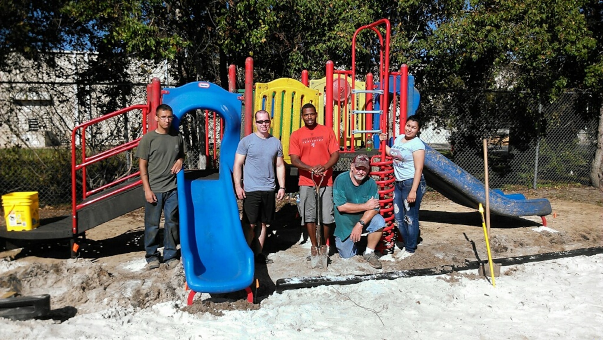 Volunteers from the 1st Special Operations Logistics Readiness Squadron stand on the playground they constructed at Liza Jackson Preparatory School in Fort Walton Beach, Fla., Oct. 12, 2013. The group logged about 200 volunteer hours completing the project. (Courtesy photo)