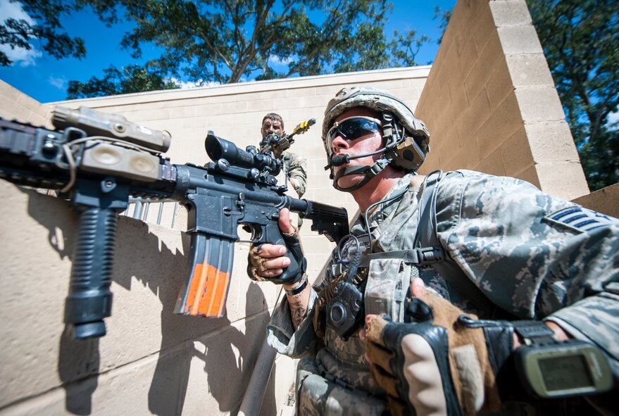 U.S. Air Force Staff Sgt. Pablo Cancel, 822d Base Defense Squadron, keeps a lookout at the military operations in urban terrain (MOUT) village during Exercise GLOBAL EAGLE at Moody Air Force Base, Ga., Oct. 17, 2013. The training scenario took place at the MOUT village and was meant to simulate scenarios they may face while deployed. (U.S. Air Force photo by Senior Airman Jarrod Grammel/Released)
