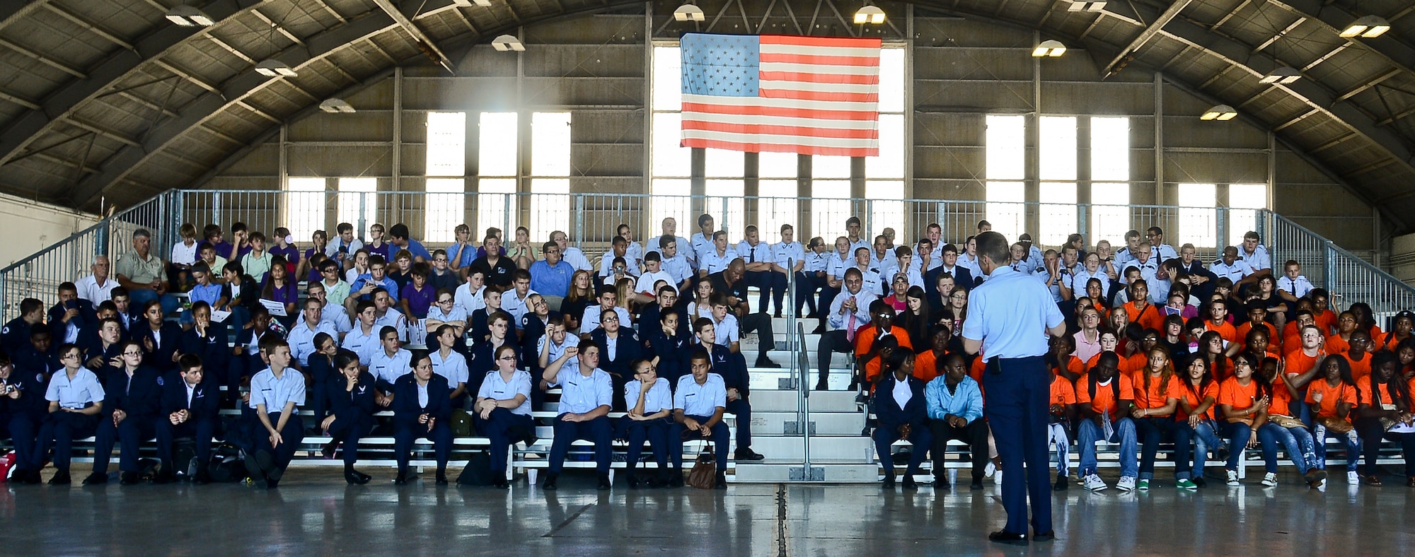 Col. Scott DeThomas, 6th Air Mobility Wing commander, talks to high school students from the local area at ROTC day, Oct. 18, 2013, at MacDill Air Force Base, Fla. DeThomas spoke about his career in the Army National Guard, Air Force and his time at the Air Force Academy. (U.S. Air Force photo by Airman 1st Class Ned T. Johnston/Released)