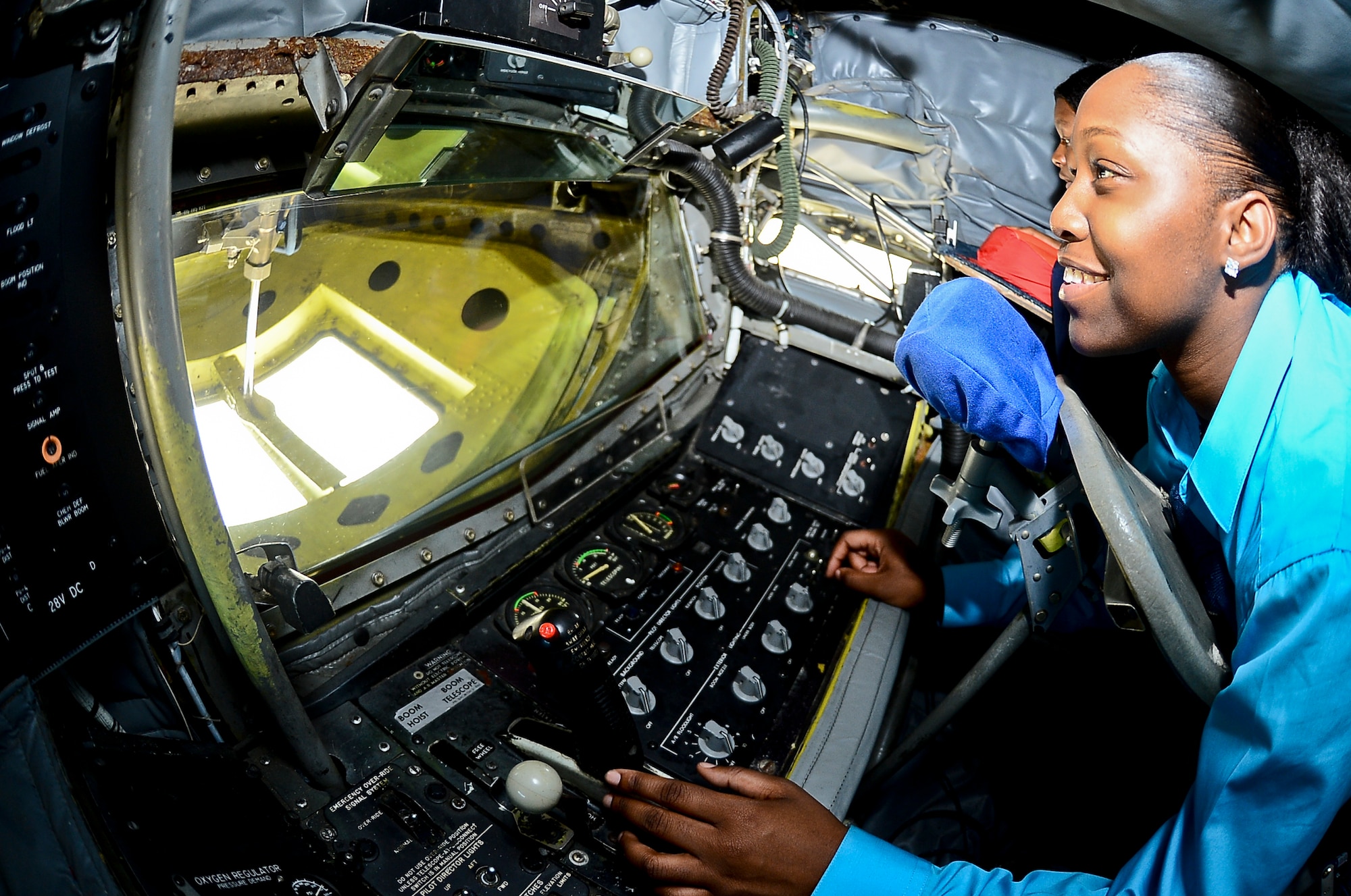 Montia Blackwood, senior at Kathleen High School, looks through the boom window of a KC-135 Stratotanker static display during ROTC day, Oct. 18, 2013, at MacDill Air Force Base, Fla. The static display of the KC-135 was one of 10 different areas set up for high school students to tour. (U.S. Air Force photo by Airman 1st Class Ned T. Johnston/Released)