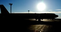 A B52H Stratofortress sits idle on the flight line during the early morning hours awaiting takeoff at Minot Air Force Base, N.D., Oct. 16. Each week, Minot AFB generates sorties to maintain mission readiness for aircrew and maintainers . (U.S. Air Force photo/Airman 1st Class Andrew Crawford)